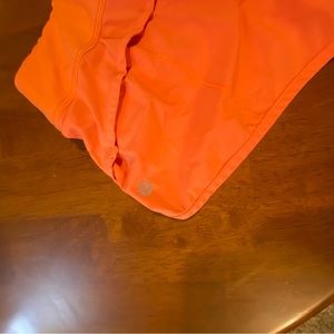 Lululemon orange running shorts for women.  2.5 in orange color